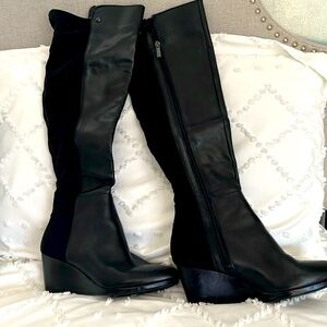Black leather and fabric tall boots. Hardly worn  Size 8 1/12 wide